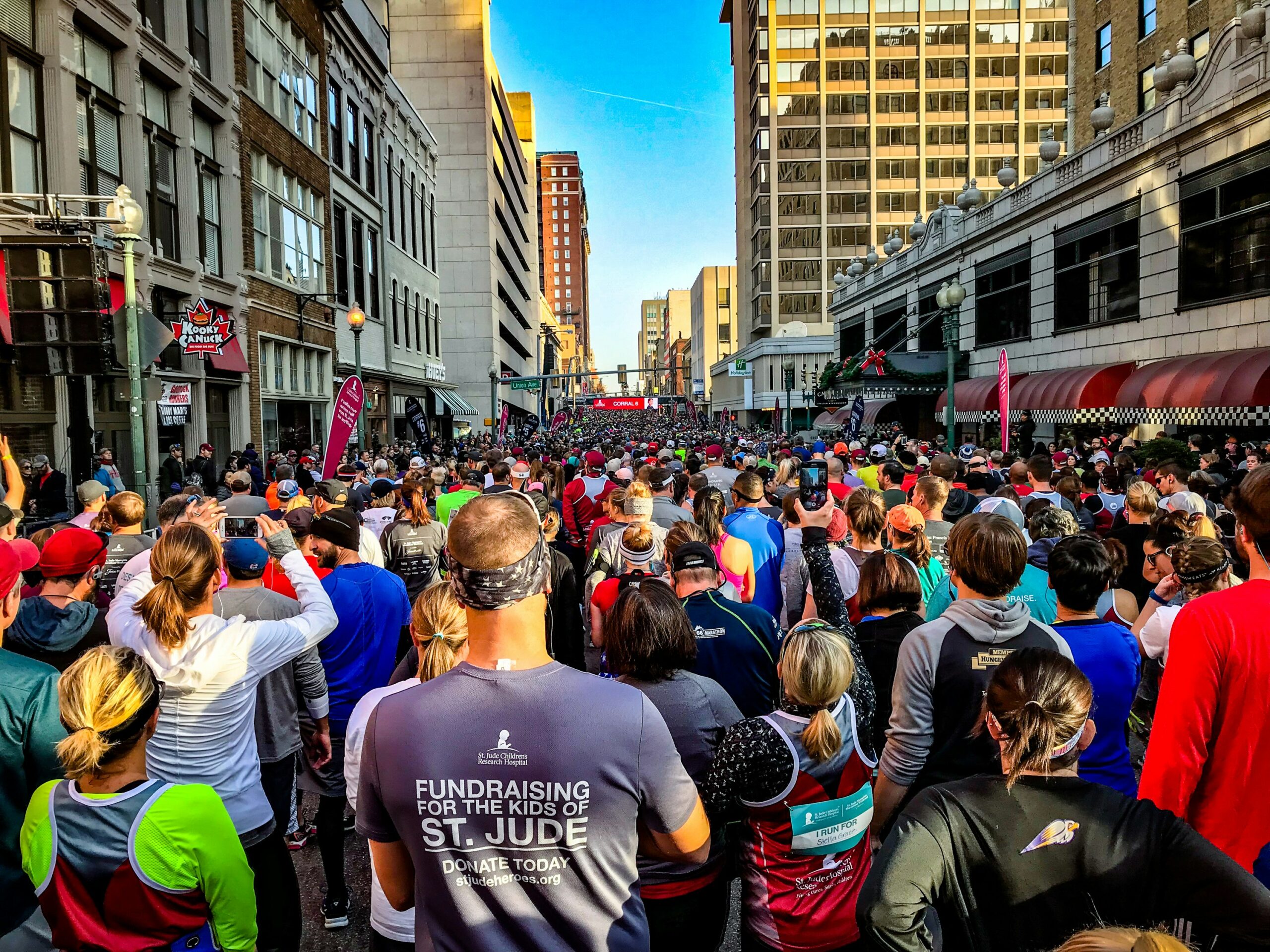 a huge crowd gathers to participate in a walk a thon fundraiser