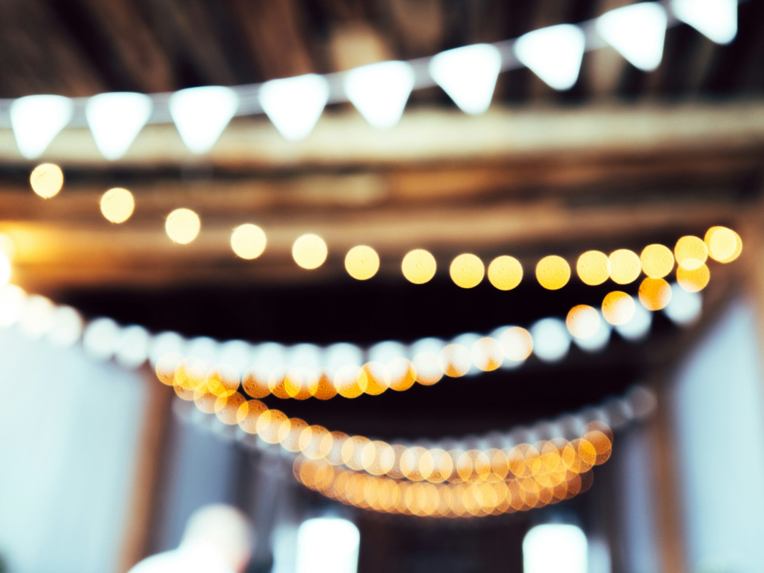 twinkle lights hang over an event space