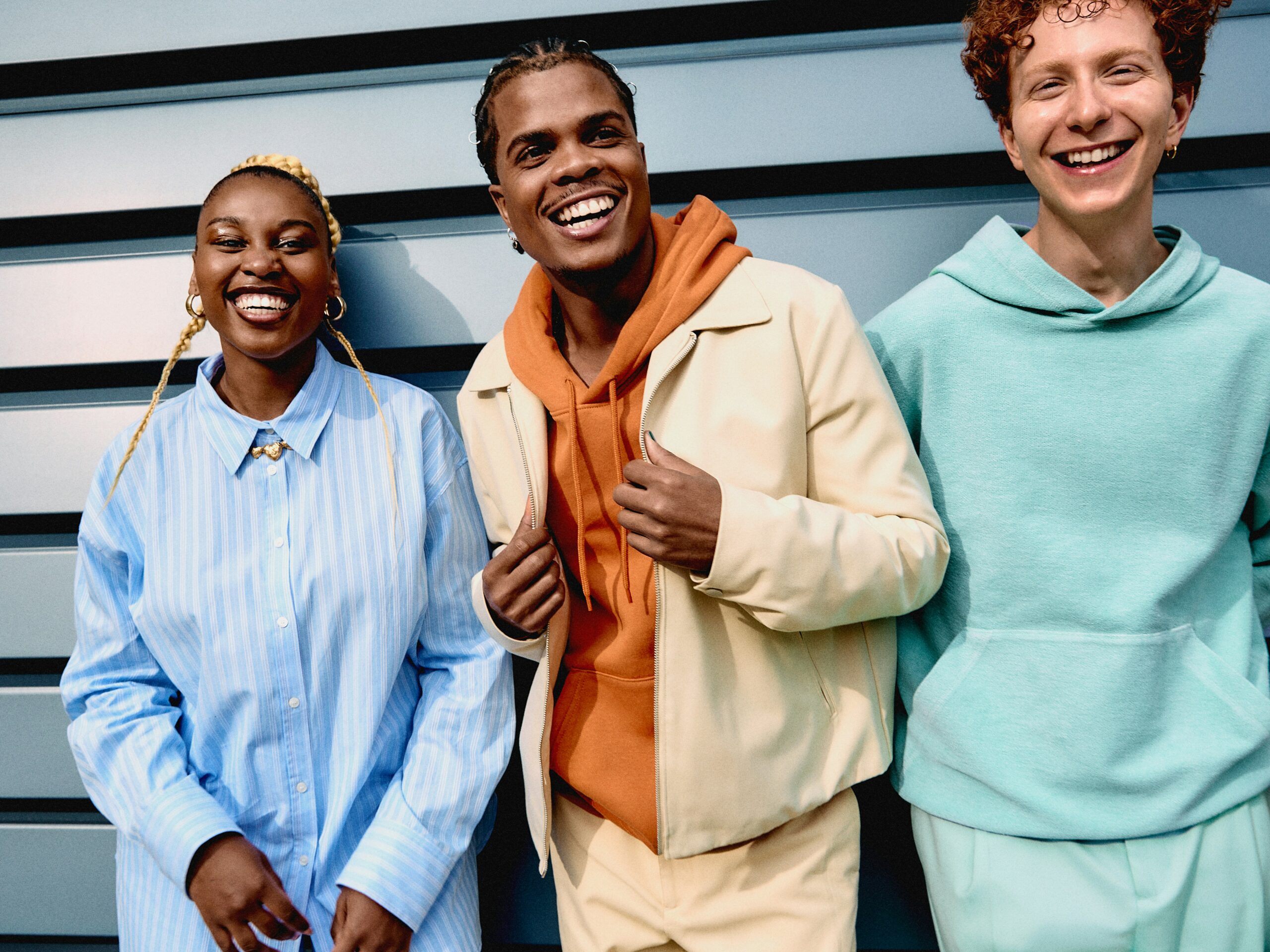 three young people laugh and have a good time